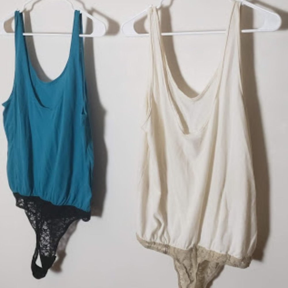 Two Loose Free People Tank Bodysuits